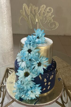 Gold and Navy Blue with Cascading Fresh Flowers Wedding Cake