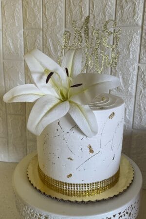 White and Gold Splash Wedding Cake with Accent Flowers