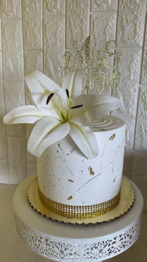 White and Gold Splash Wedding Cake with Accent Flowers