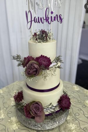 Purple and white 3 tier Wedding Cake with fresh flowers